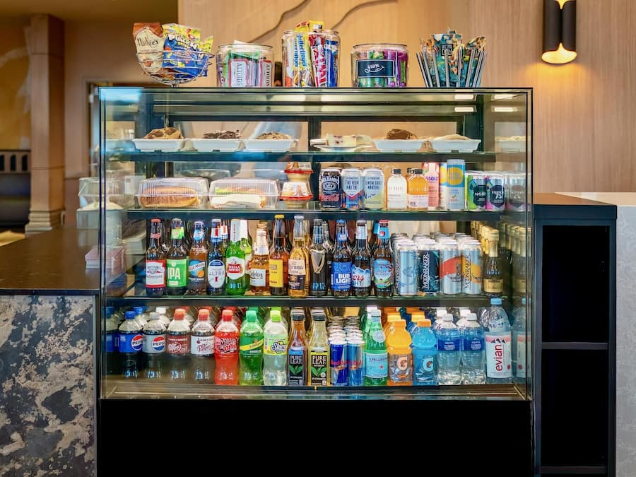 A refrigerated display case with various food items and beverages.