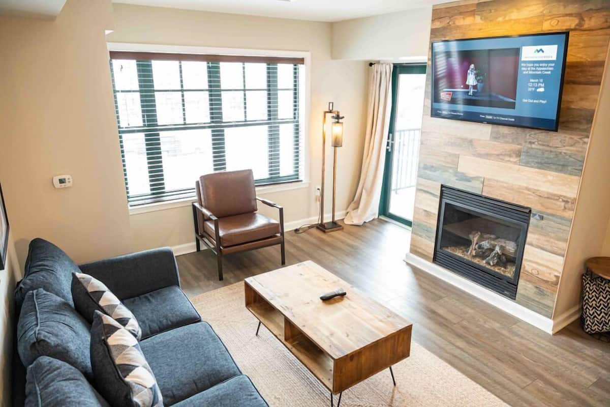 Premium Suite, 1 Bedroom, Kitchen | Living area | 55-inch TV with cable channels, table tennis