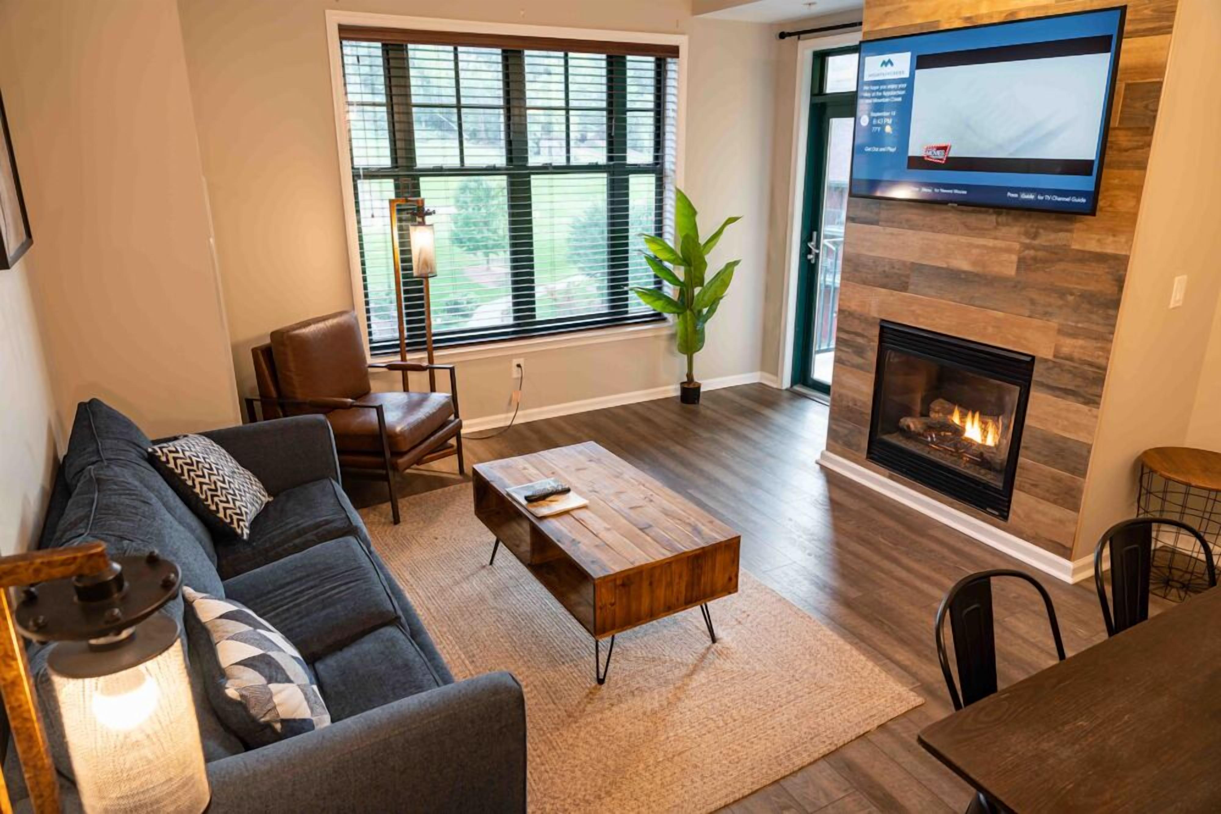 Premium Suite, 2 Bedrooms, Kitchen | Living area | 55-inch TV with cable channels, table tennis