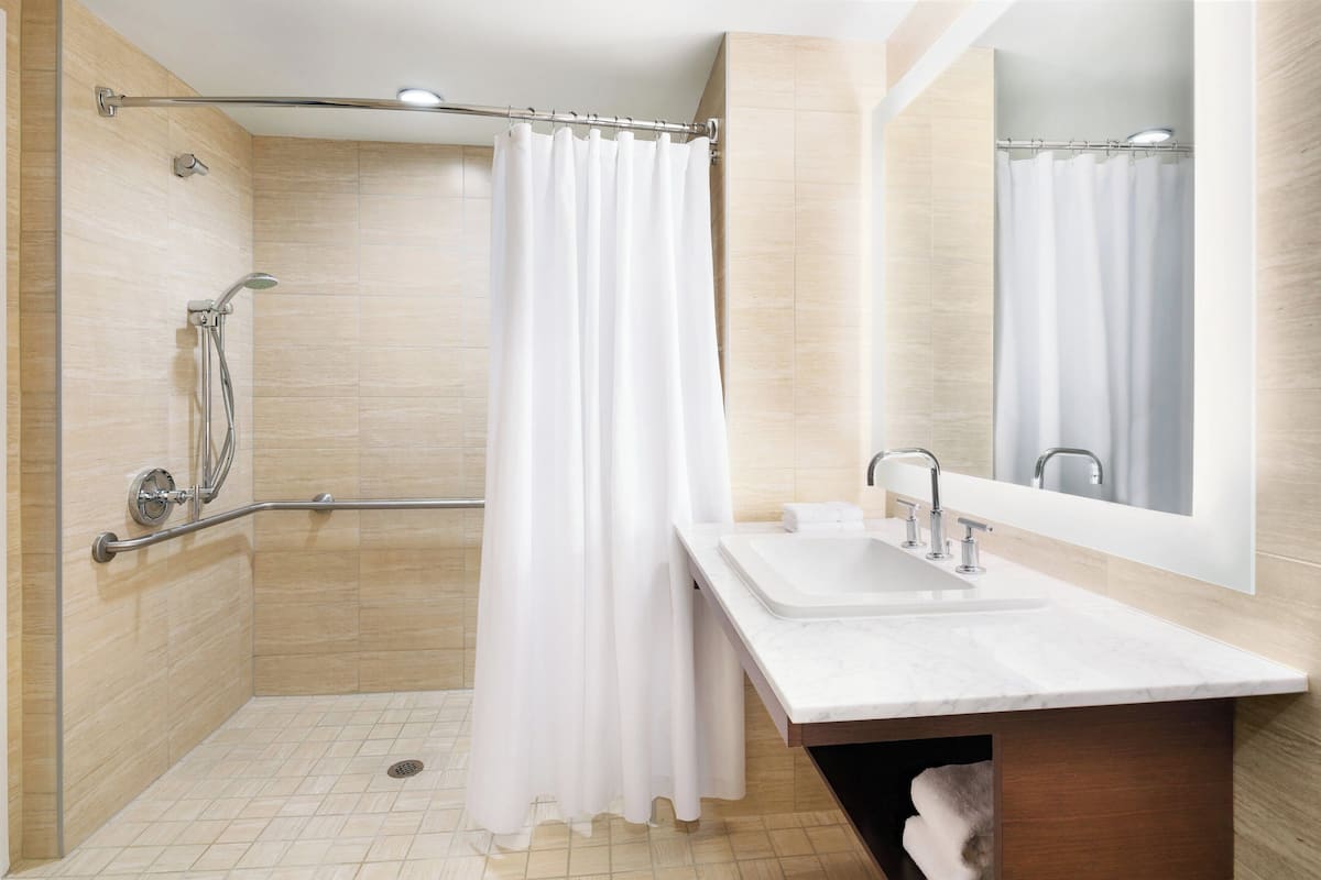 separate bathtub and shower, deep-soaking bathtub, free toiletries