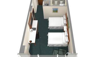 A hotel room with two beds, a desk, a chair, a small bathroom, and a painting on the wall.