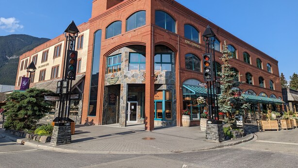 A hotel with a stone facade, multiple windows, and a prominent entrance. - King Edward Hotel  (Banff)