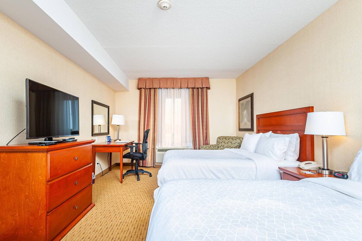 Hypo-allergenic bedding, desk, laptop workspace, blackout curtains