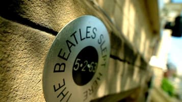 A metal plaque with the inscription "THE BEATLES" and a date "5-2-63".