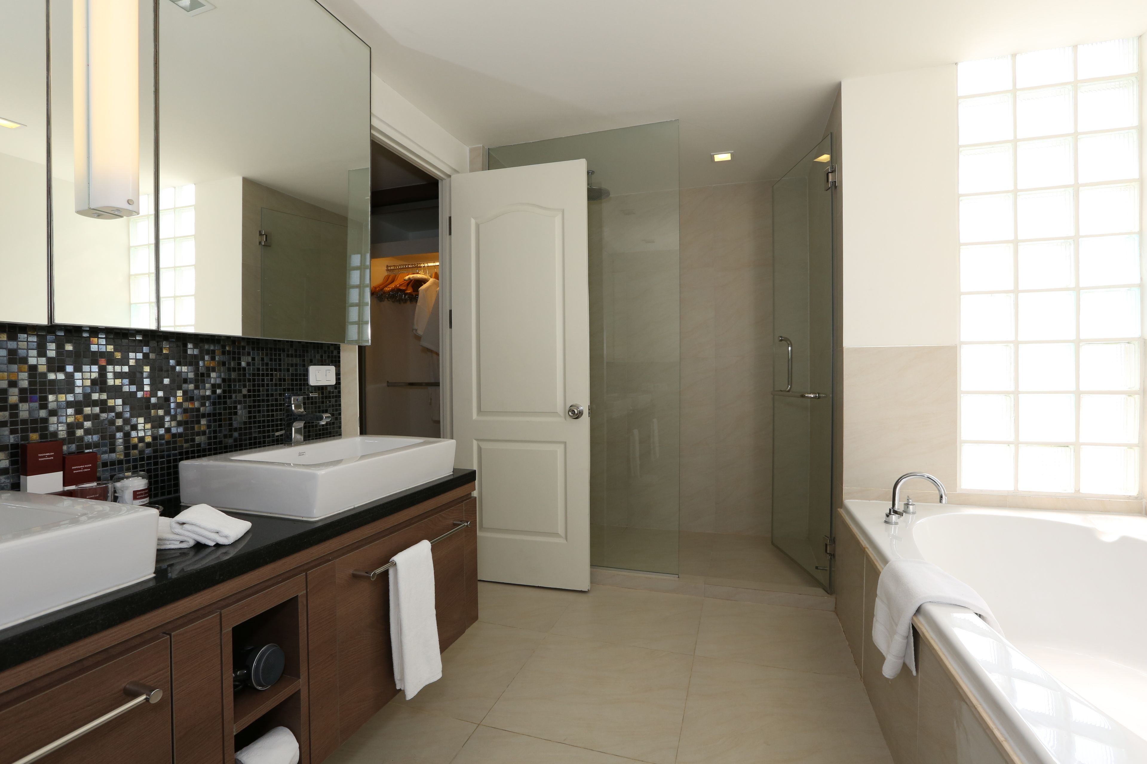 three bedroom deluxe | bathroom | combined shower/bathtub, free toiletries, hair dryer, dressing gowns