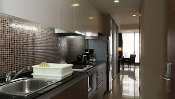 Three Bedroom Deluxe | Private kitchen | Fridge, coffee/tea maker