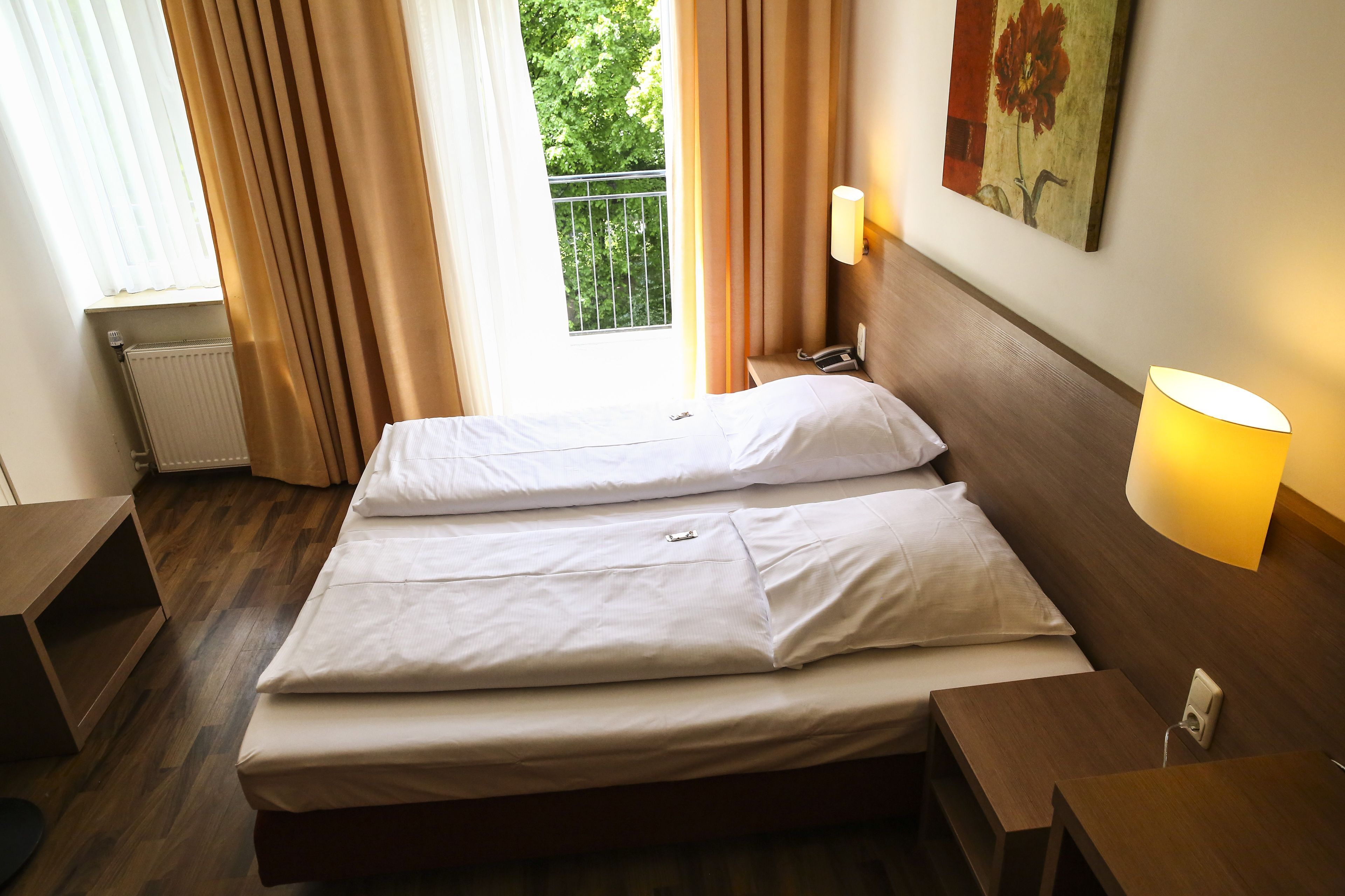 Hypo-allergenic bedding, desk, iron/ironing board, rollaway beds