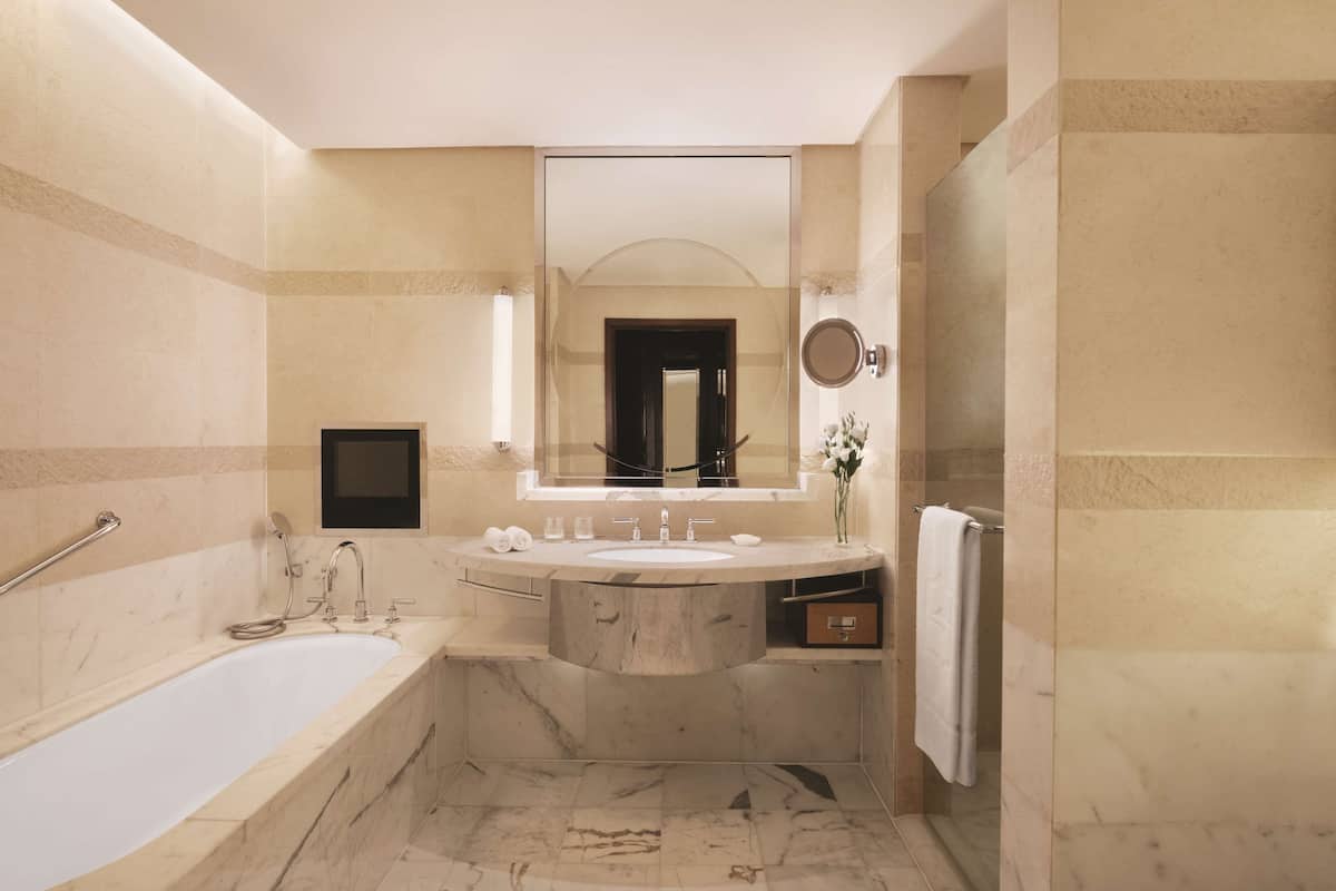 horizon club river view room 1 king | bathroom | separate bathtub and shower, deep-soaking bathtub, rainfall showerhead