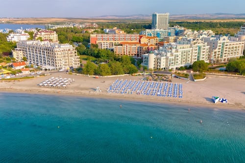 On the beach, sun loungers, beach umbrellas, beach towels