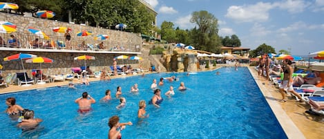 Indoor pool, pool umbrellas, pool loungers