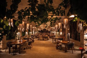 An indoor dining area with tables and chairs arranged for guests. - Borgo Egnazia (Fasano)