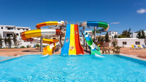 A water park with multiple slides and a pool. - Zodiac Hotel (Hammamet)