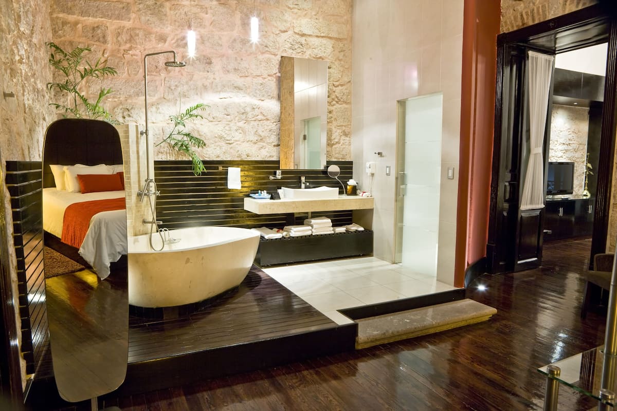 master suite | bathroom | separate bathtub and shower, designer toiletries, hair dryer, bathrobes