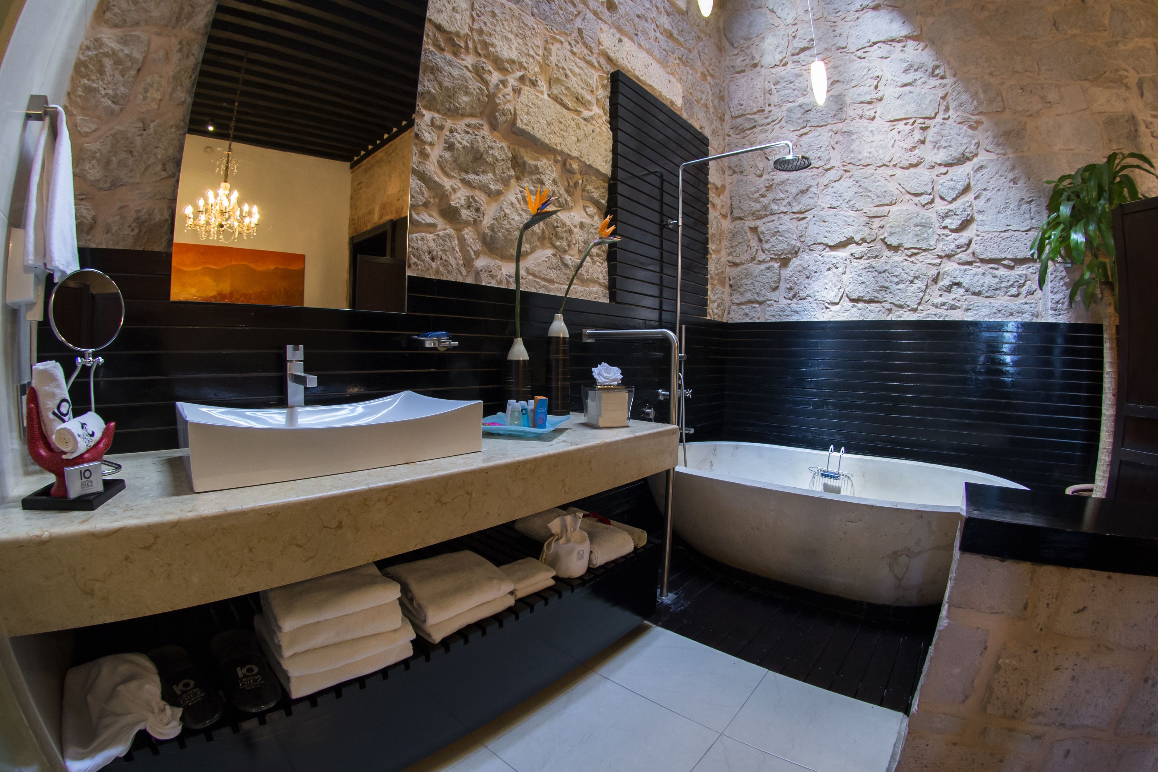 master suite | bathroom | separate bathtub and shower, designer toiletries, hair dryer, bathrobes