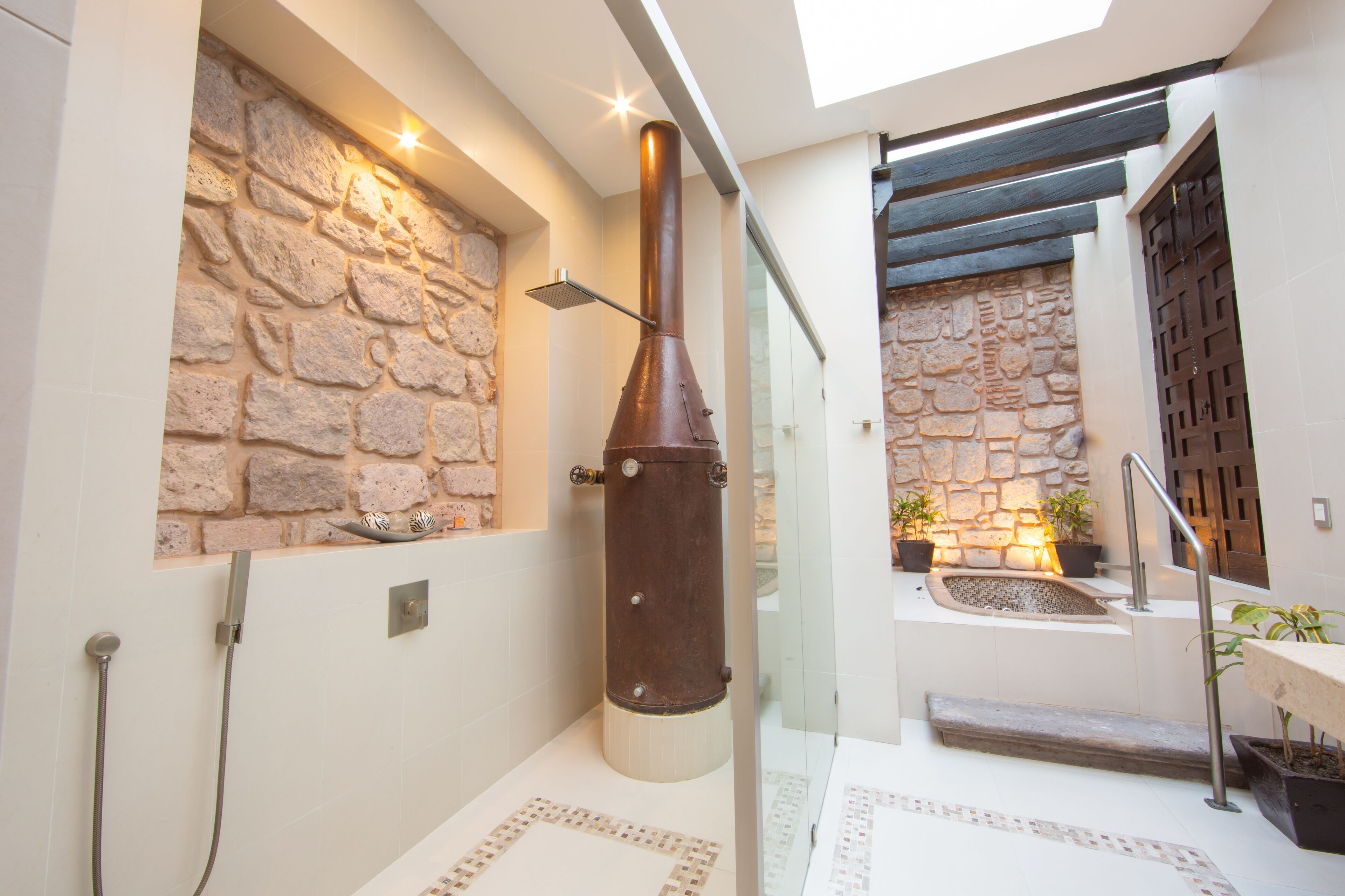 junior suite king size bed | bathroom | separate bathtub and shower, designer toiletries, hair dryer, bathrobes