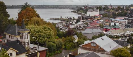 A coastal town with buildings, a waterfront, and a prominent church.