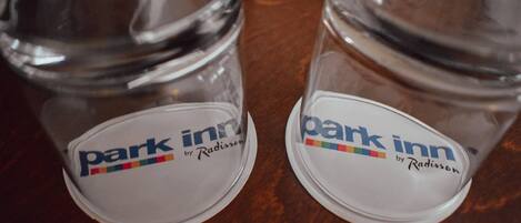 Two clear glass jars with lids, each labeled 'park inn by Radisson.'