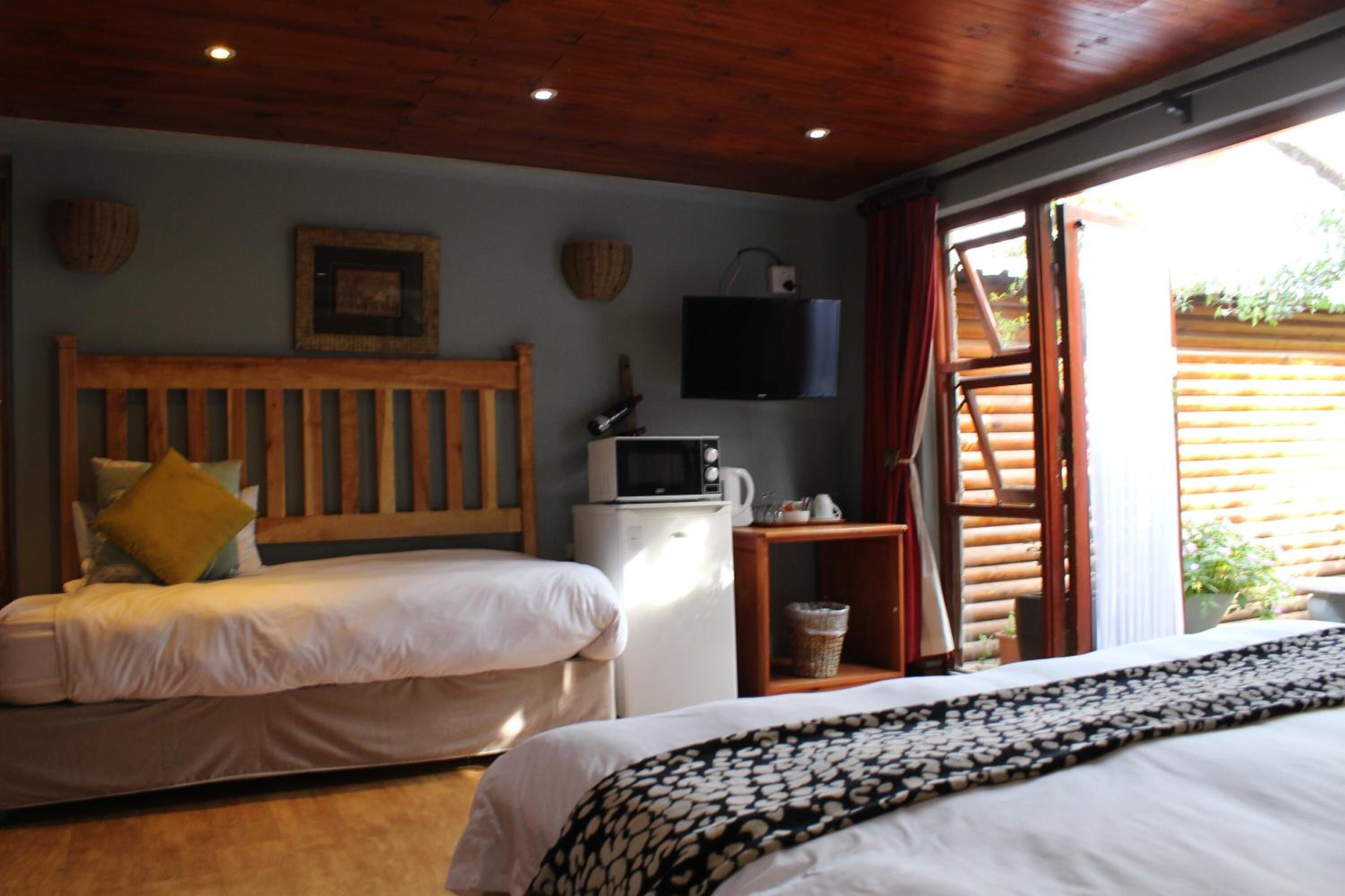 family poolside room c | minibar, in-room safe, desk, iron/ironing board