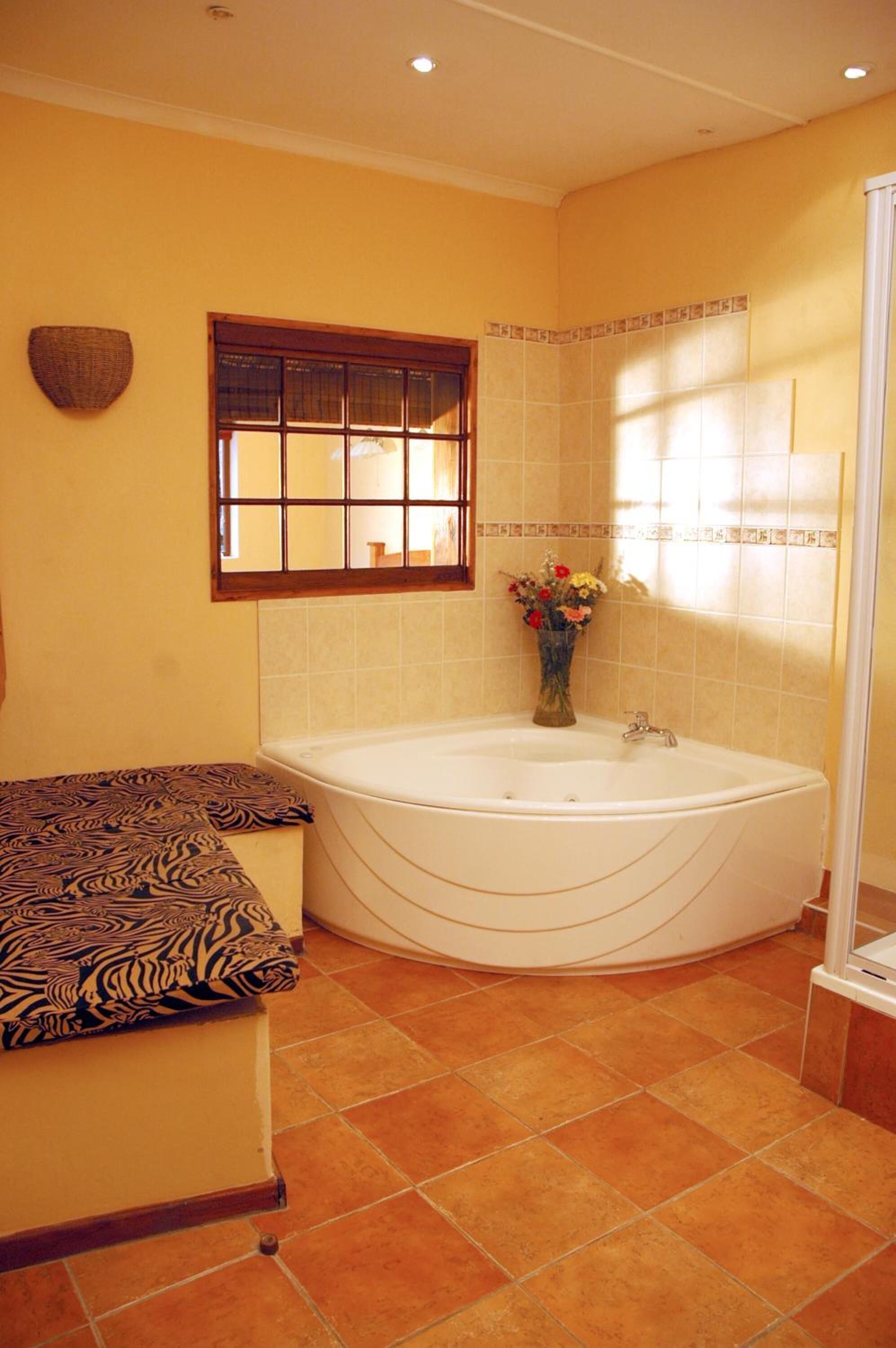 separate bathtub and shower, jetted bath, hair dryer, towels