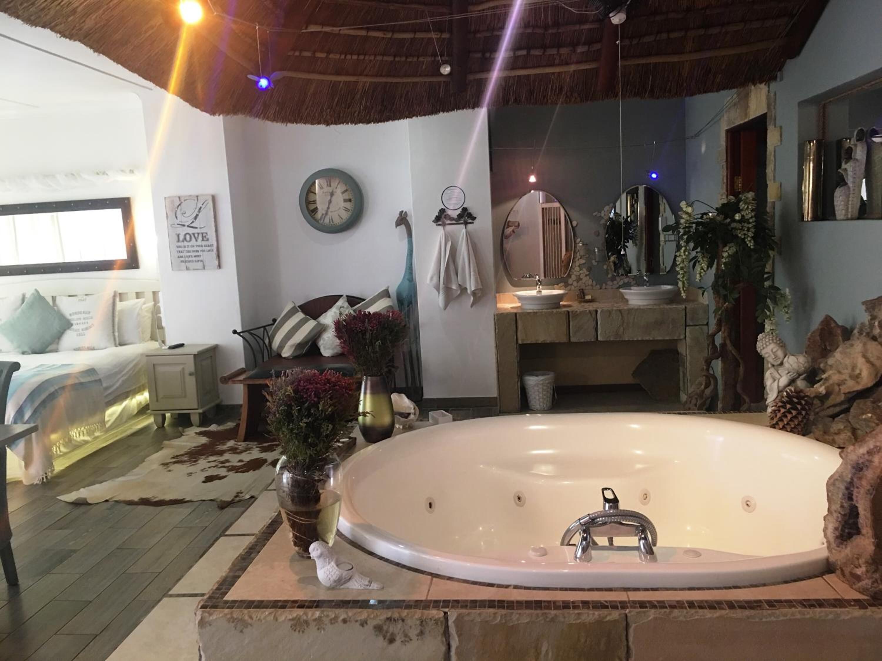 honeymoon suite | bathroom | separate bathtub and shower, jetted bath, hair dryer, towels