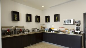 A modern kitchen with built-in appliances, a granite countertop, and a clean, minimalist design. - One Aguascalientes Sur (Aguascalientes)