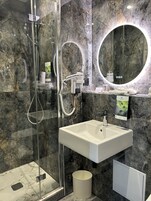 Shower, free toiletries, hair dryer, towels
