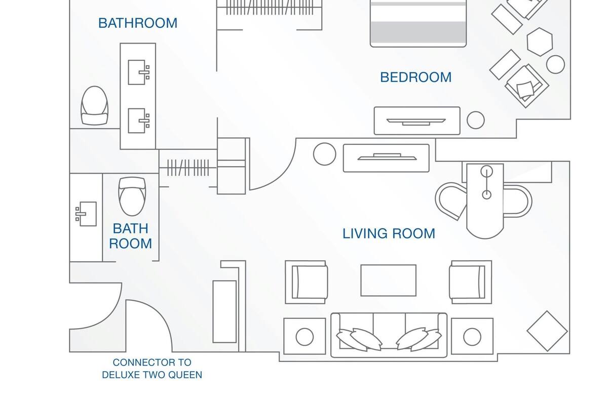 A floor plan of a hotel room with a bathroom, bedroom, and living room.