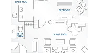 A floor plan of a hotel room with a bathroom, bedroom, and living room.