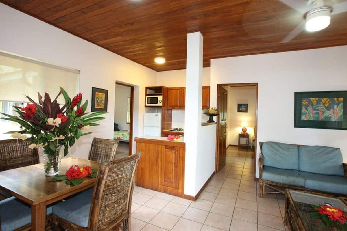 suite, 2 bedrooms, pool view | living area | 54-cm flat-screen tv with satellite channels, tv, dvd player