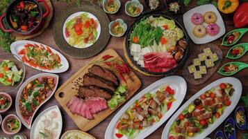 A variety of dishes on a wooden table.