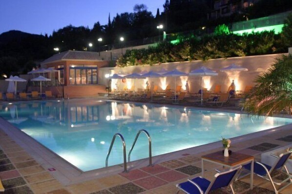 Seasonal outdoor pool, open 10 AM to 8:00 PM, pool umbrellas
