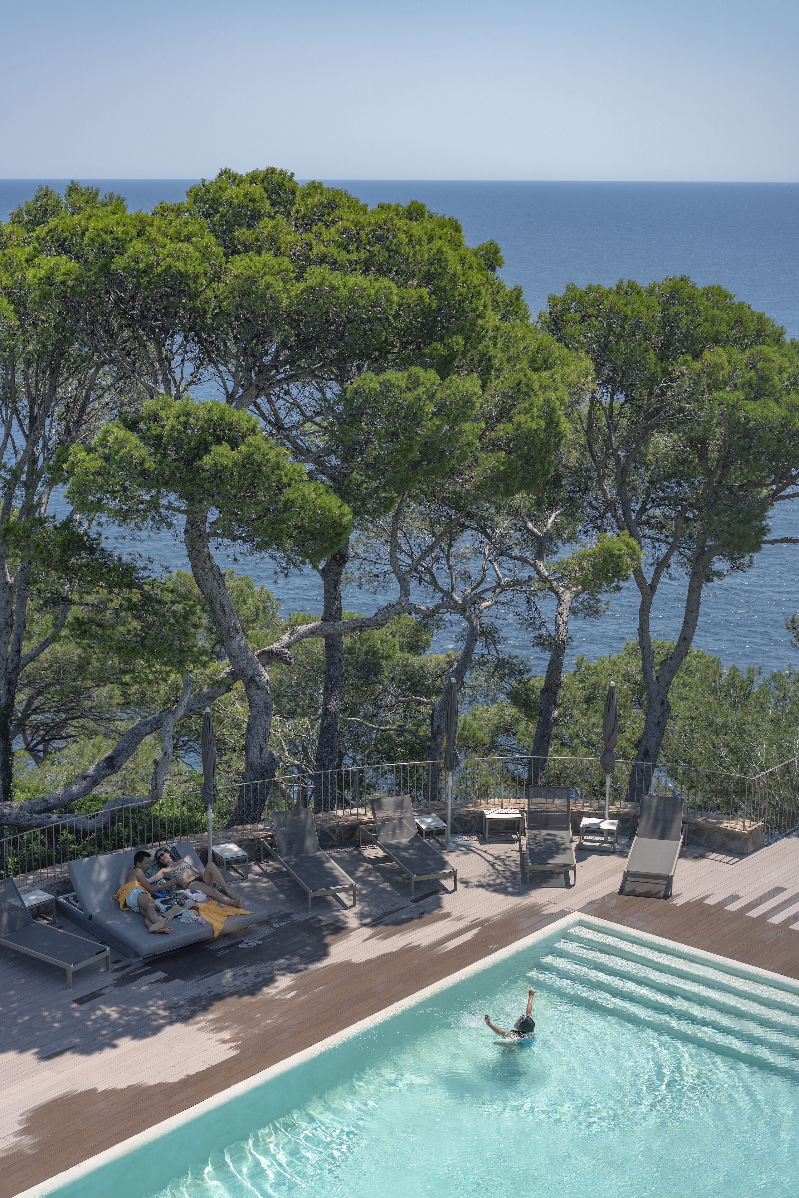 seasonal outdoor pool, pool umbrellas, pool loungers