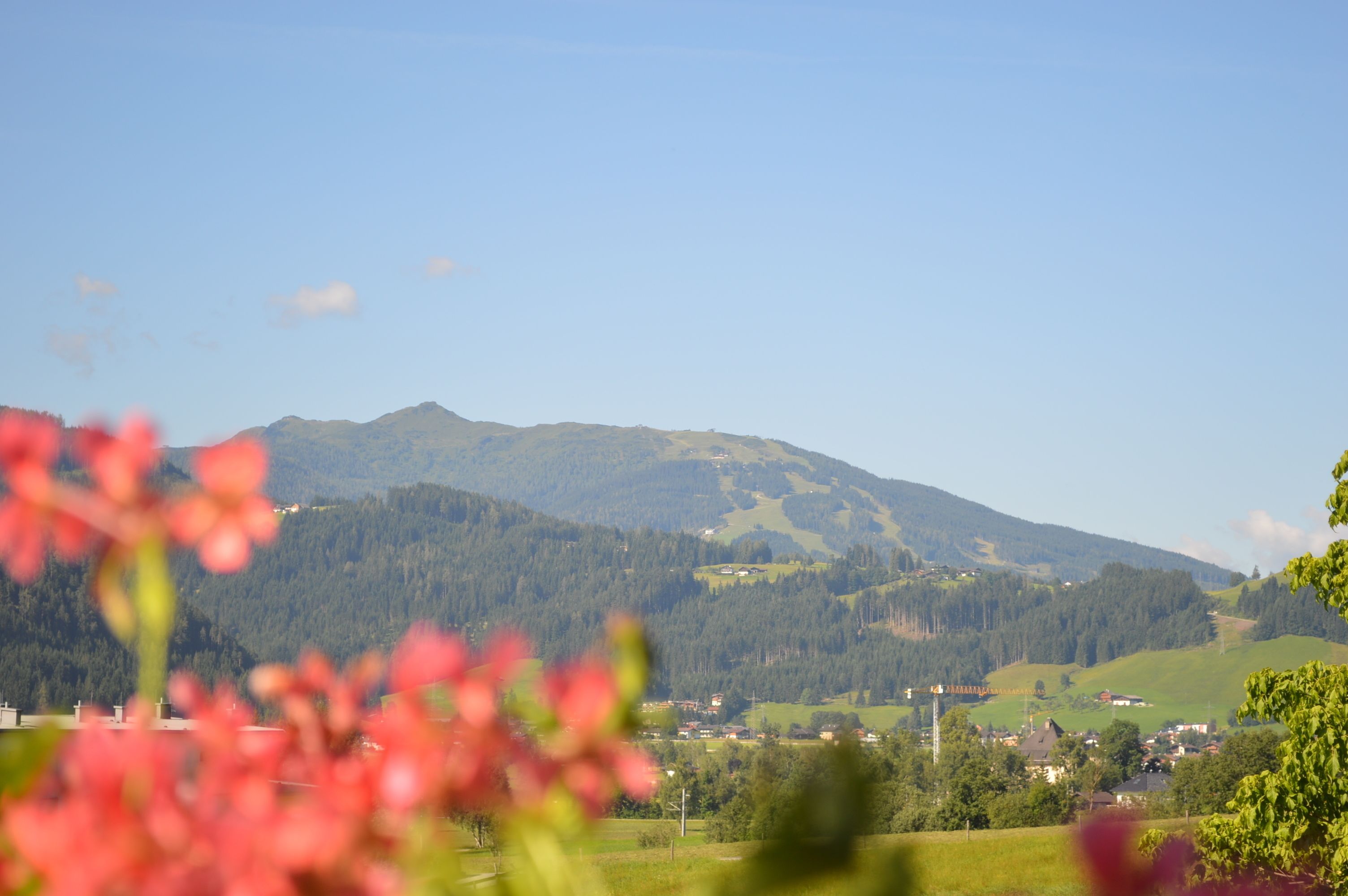 A mountainous landscape with a village in the valley.