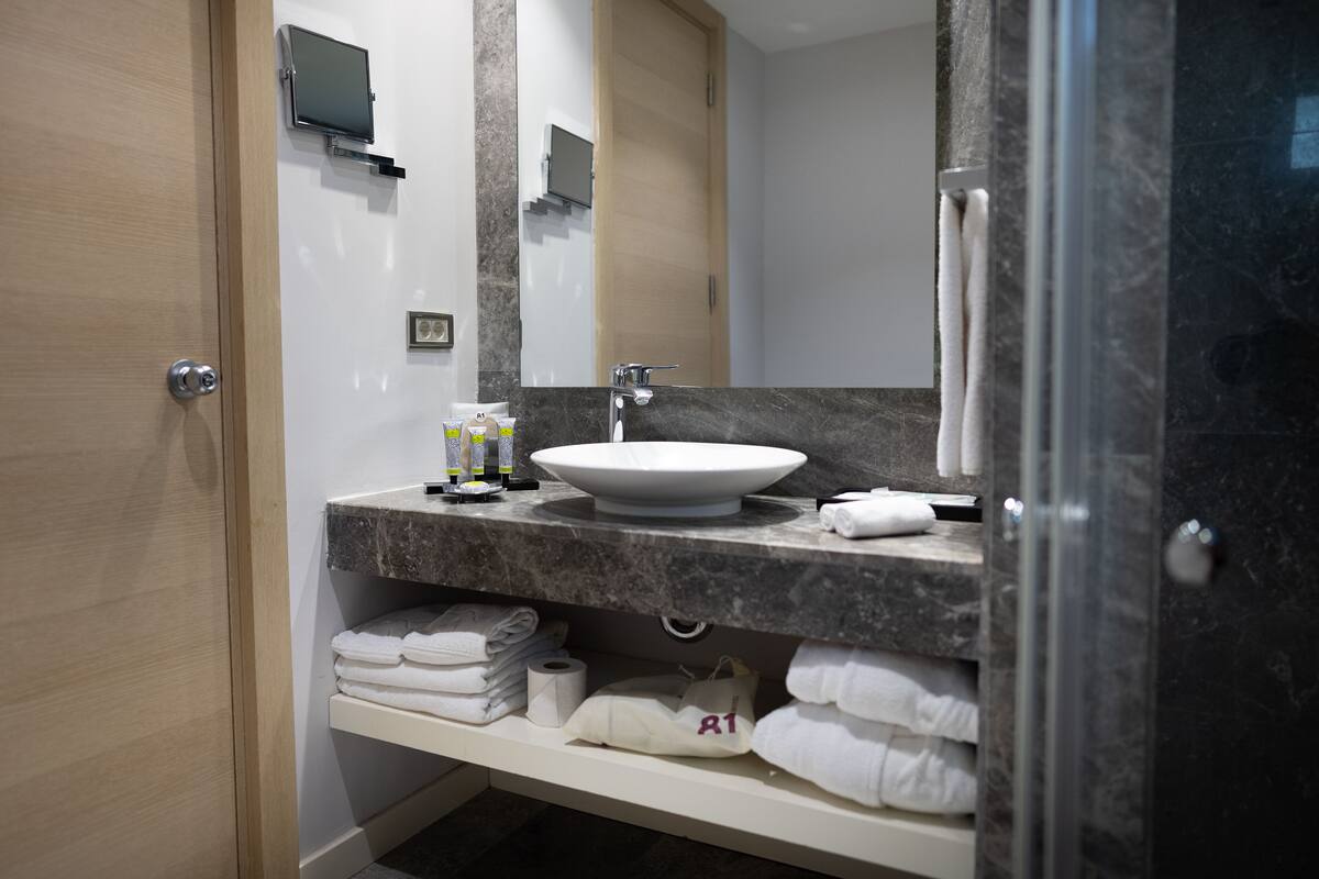 beachfront garden view room | bathroom | shower, designer toiletries, hair dryer, bathrobes