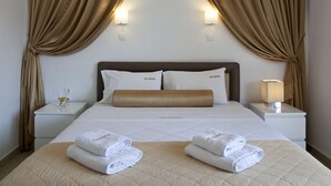 A hotel room with a bed, two nightstands, a lamp, and curtains. - Metropolis Hotel (Athens)