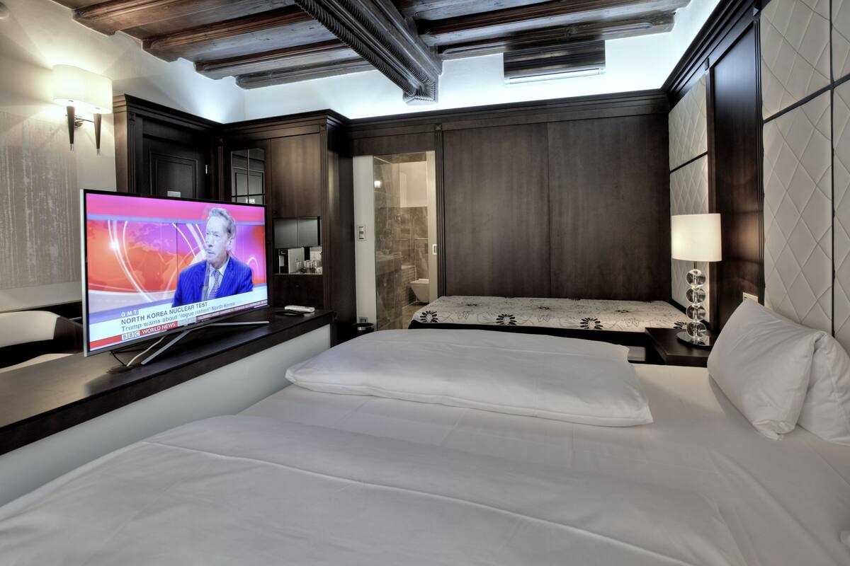 triple room (depandance  - panská street) | minibar, in-room safe, desk, soundproofing