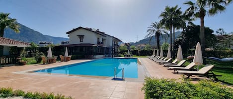 Seasonal outdoor pool, open 8:30 AM to 6:30 PM, free pool cabanas