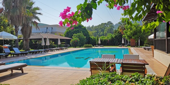 Seasonal outdoor pool, open 8:30 AM to 6:30 PM, free pool cabanas