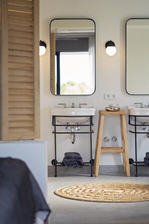 A bathroom with two sinks, a wooden stool, and a large mirror. - Yacht Boheme Hotel-adults Only (Fethiye)