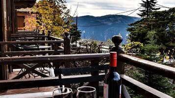 Enjoy a romantic dinner for two on this balcony overlooking the mountains.