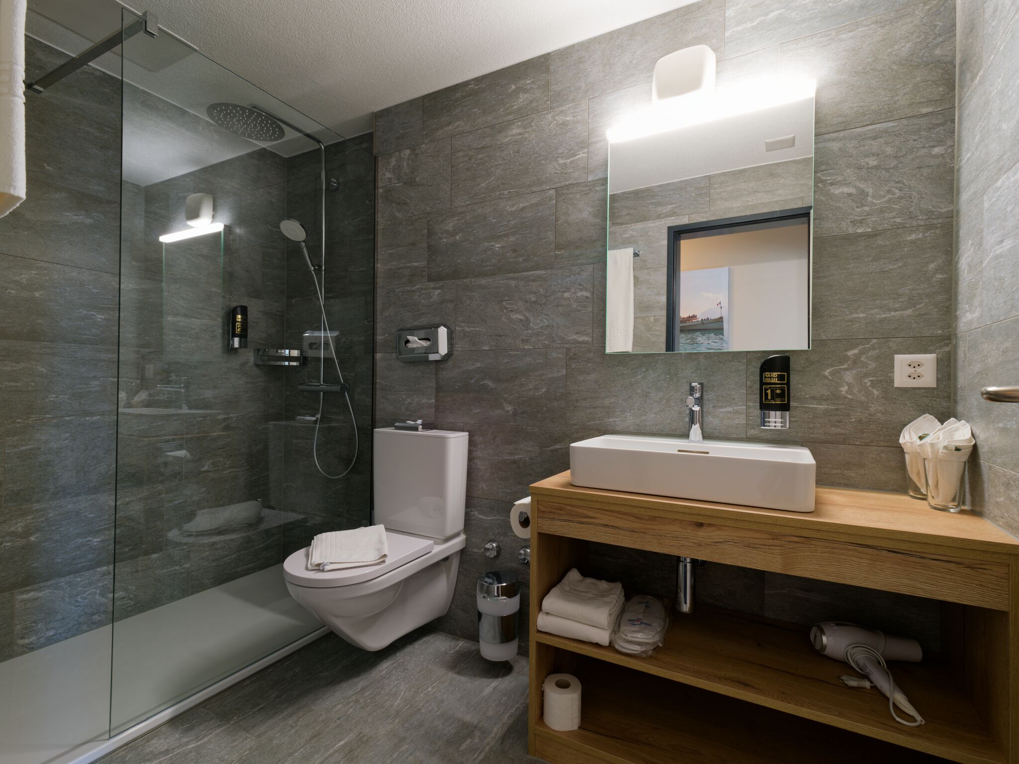 superior double room | bathroom | hair dryer, towels
