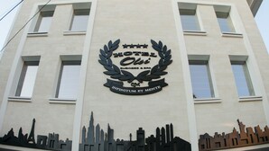 A hotel sign with a city skyline silhouette and the name "HOTEL Olsi". - Hotel Olsi (Chisinau)