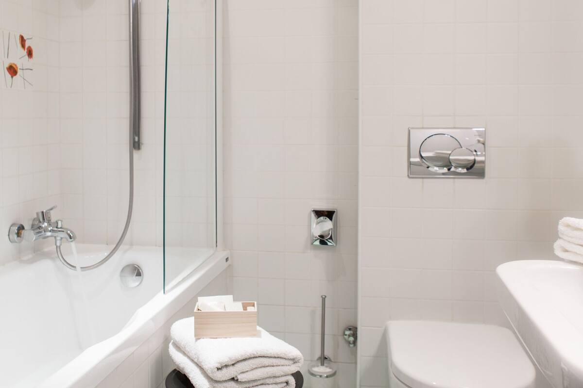 junior suite | bathroom | hair dryer, dressing gowns, towels