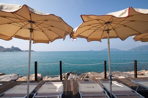 Private beach, beach towels, beach bar