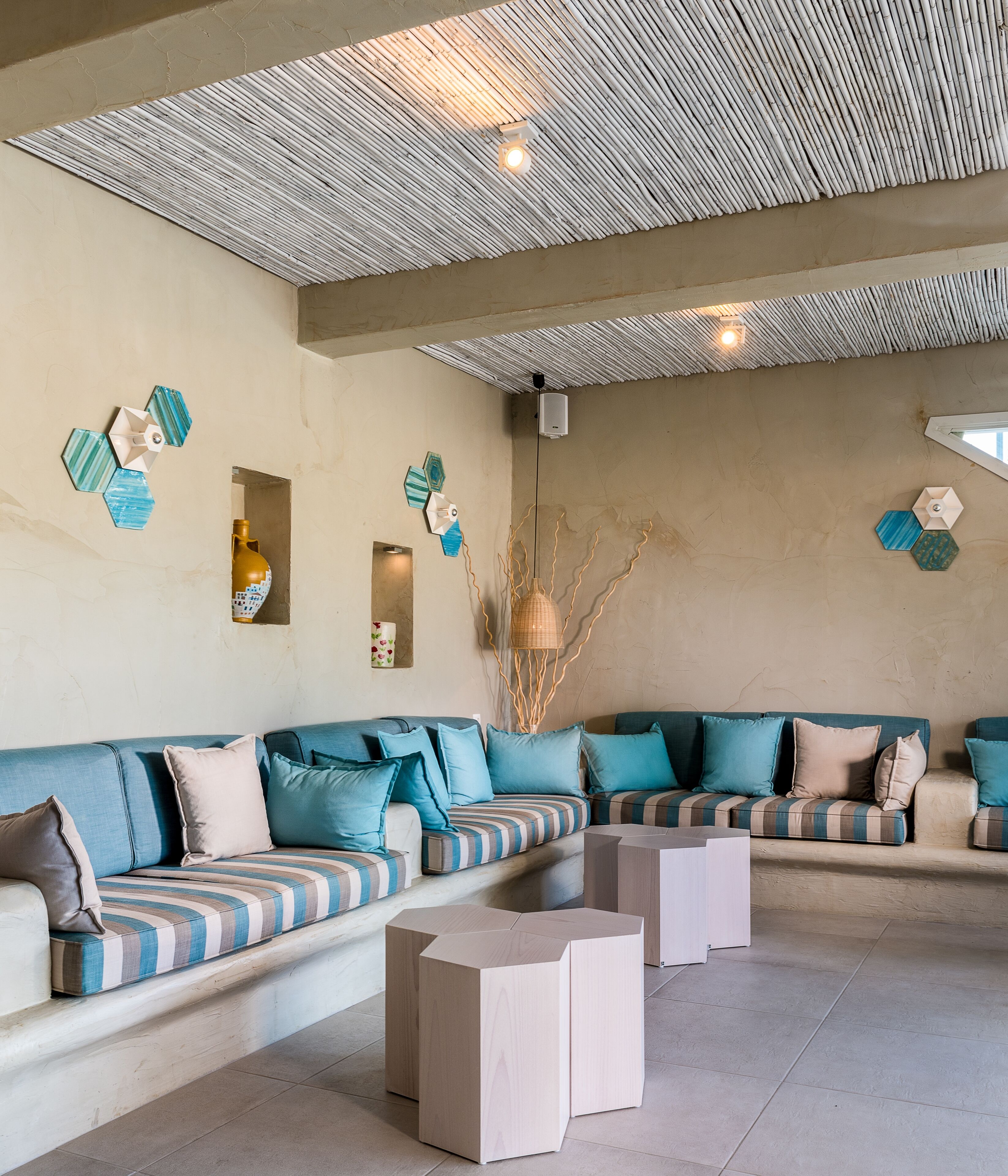 A modern living room with a sectional sofa, a coffee table, and decorative wall art.