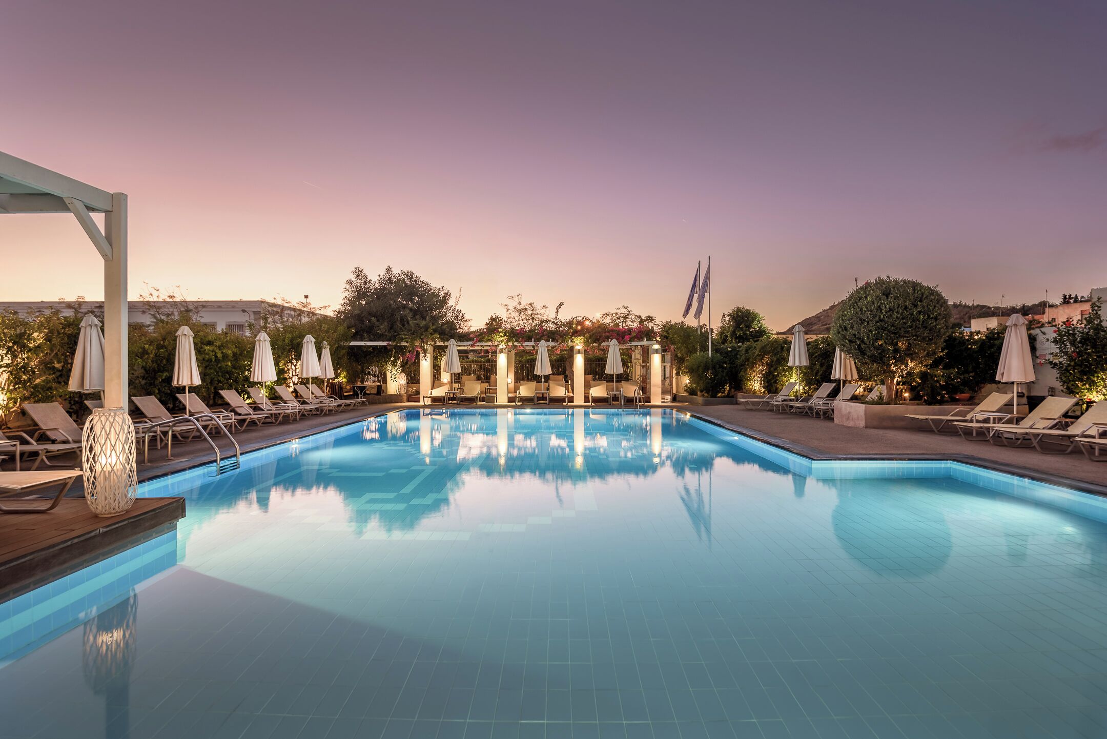 Seasonal outdoor pool, pool umbrellas, pool loungers