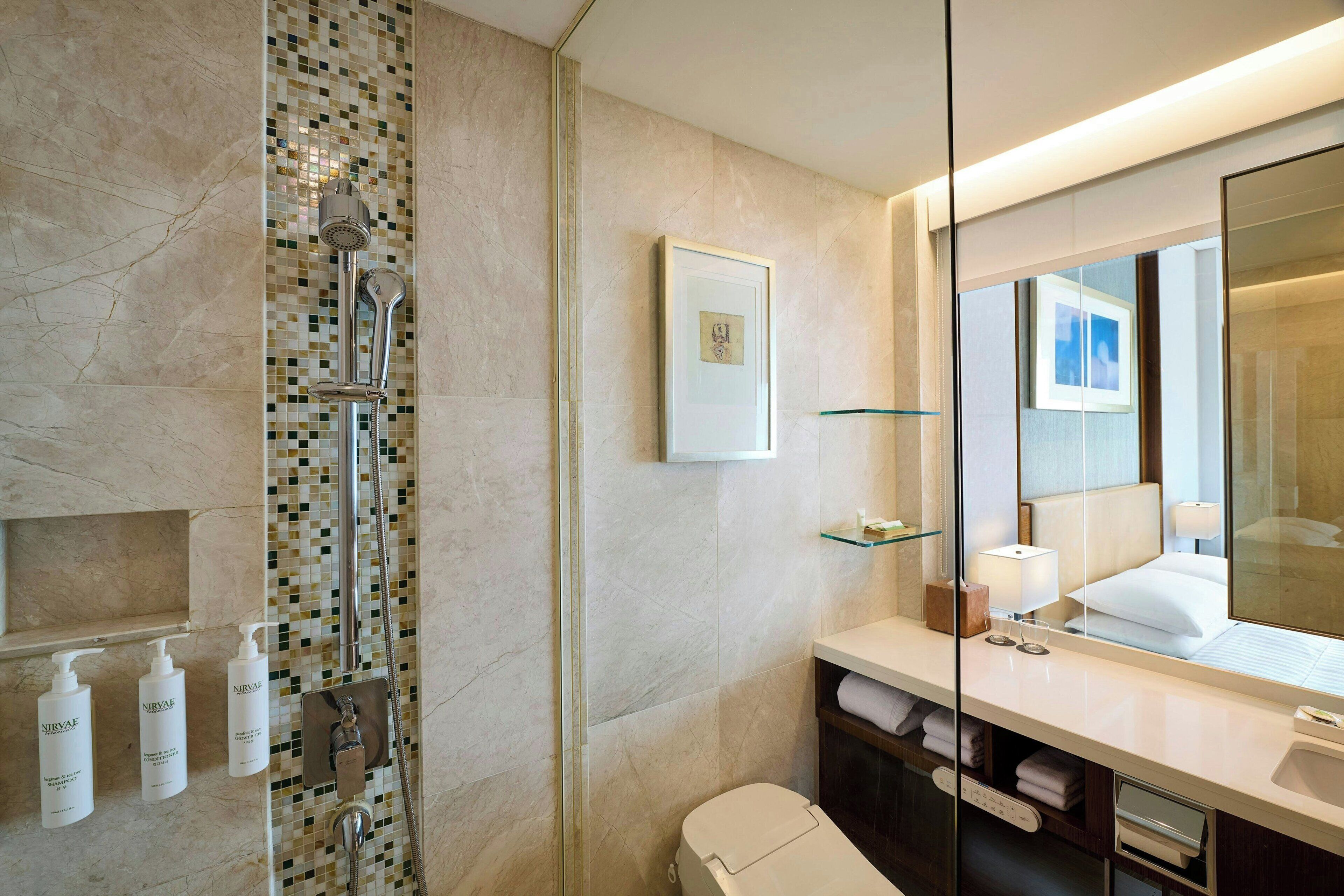 hair dryer, slippers, electronic bidet, towels