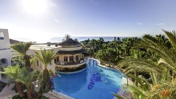 Indoor pool, seasonal outdoor pool, pool umbrellas, sun loungers