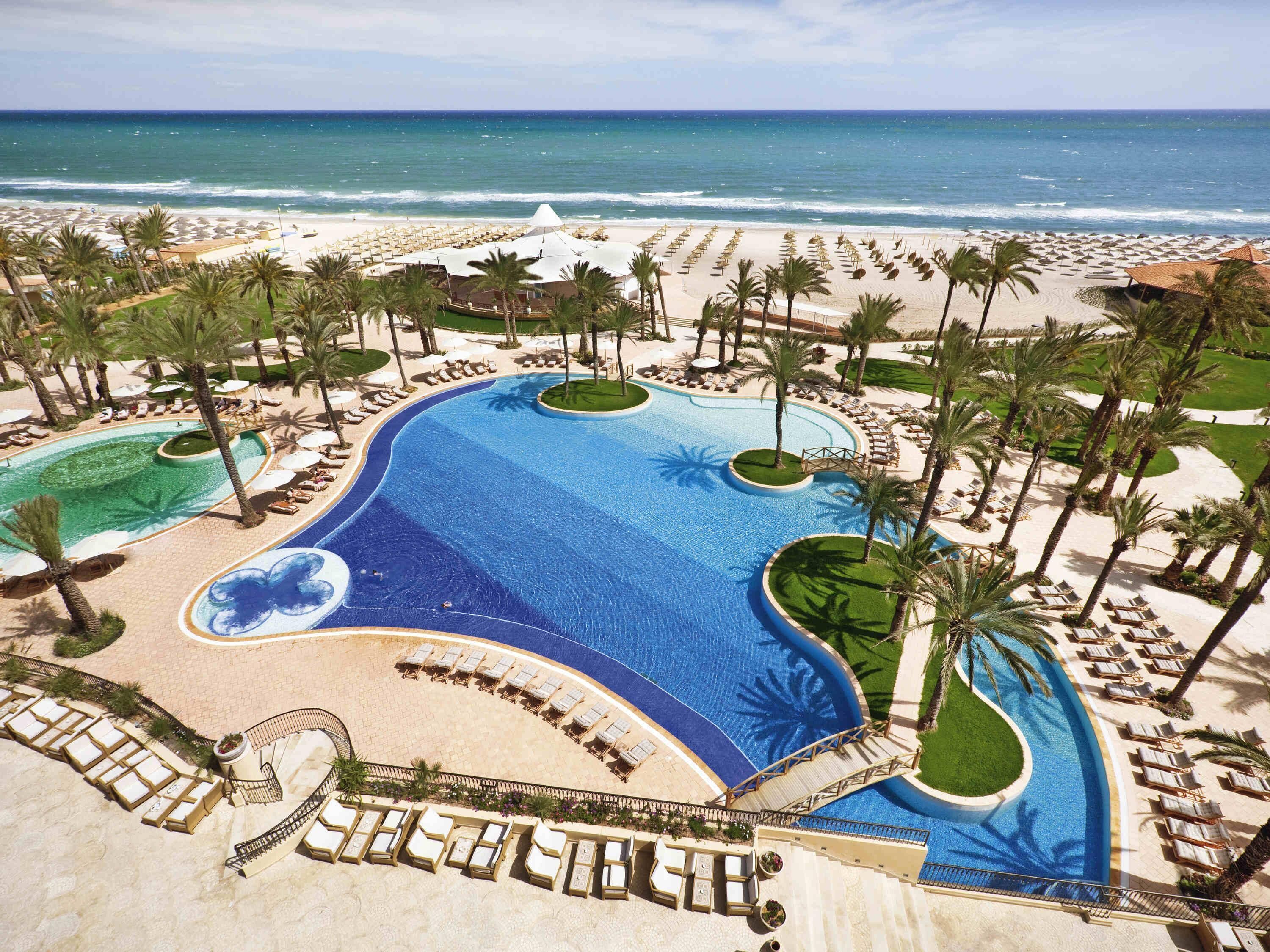 2 outdoor pools, open 8 AM to 7 PM, pool umbrellas, sun loungers