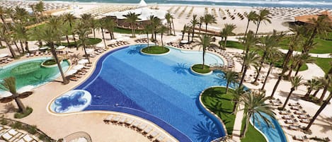 2 outdoor pools, open 8 AM to 7 PM, pool umbrellas, pool loungers